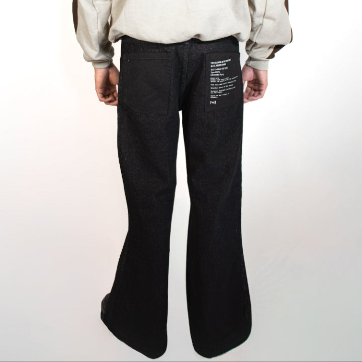 Person wearing a brown and beige hoodie with black pants on a white background