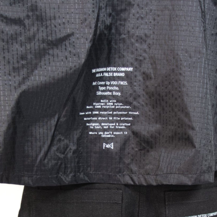 Black raincoat and shorts set on a white background