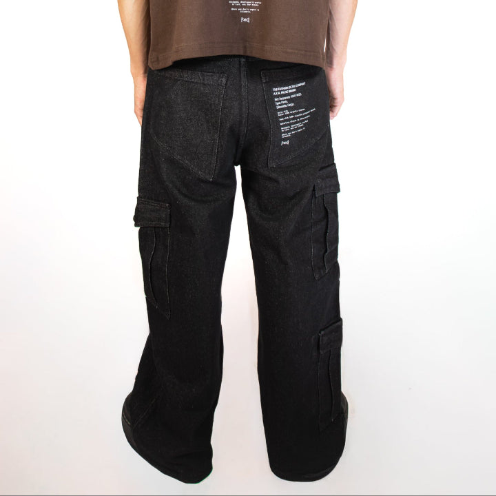 Person wearing a brown t-shirt and black pants on a white background