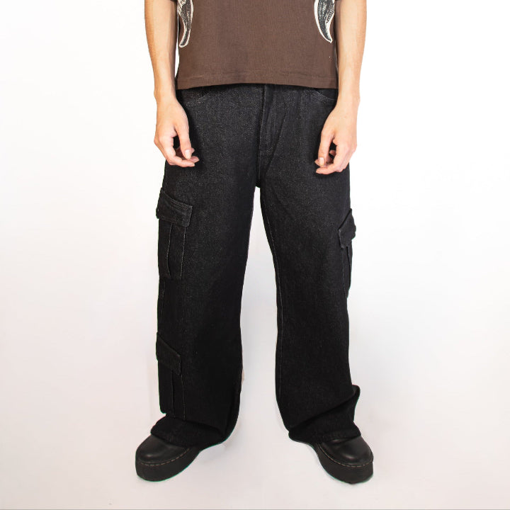 Person wearing a brown t-shirt and black pants on a white background